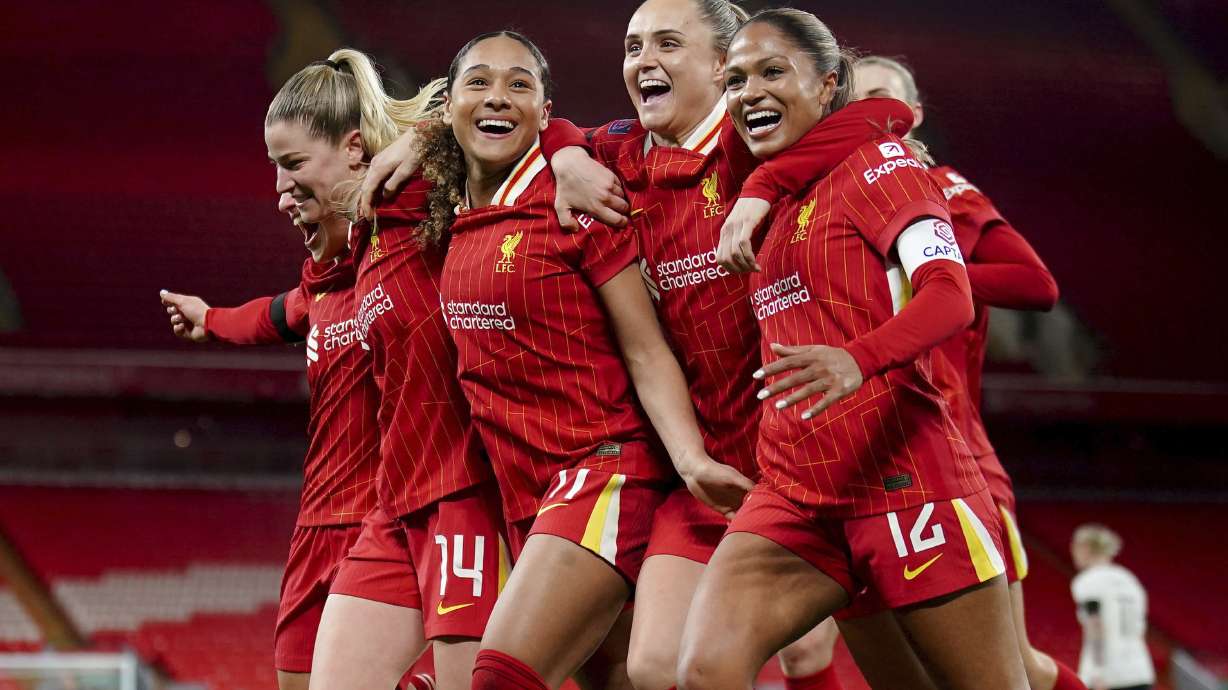 Liverpool's Olivia Smith, second left, celebrates with her team mates after scoring her sides third goal from the penalty spot during their English Women's Super League match at Anfield, Liverpool, England, Friday, March 14, 2025.
