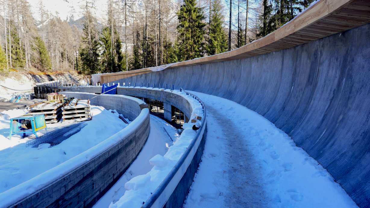 FILE - Construction work takes place at the Cortina Sliding Center, venue for the bob, luge and skeleton disciplines at the Milan Cortina 2026 Winter Olympics, in Cortina d'Ampezzo, Italy, Thursday, Jan. 16, 2025.