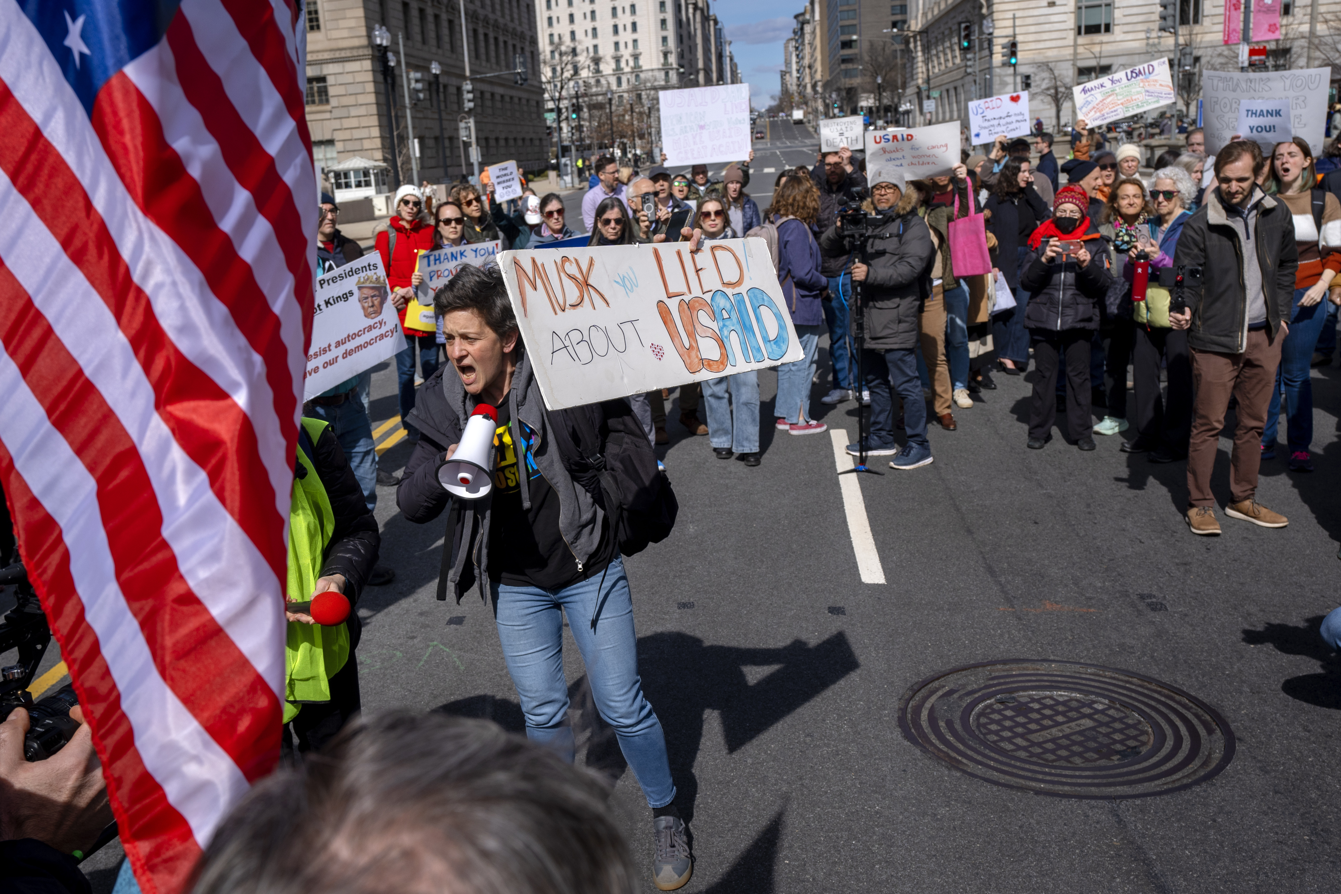 People rally in support of fired USAID workers Feb. 28 at the USAID headquarters in Washington. A federal judge ruled Tuesday that the dismantling of the agency likely violated the Constitution.