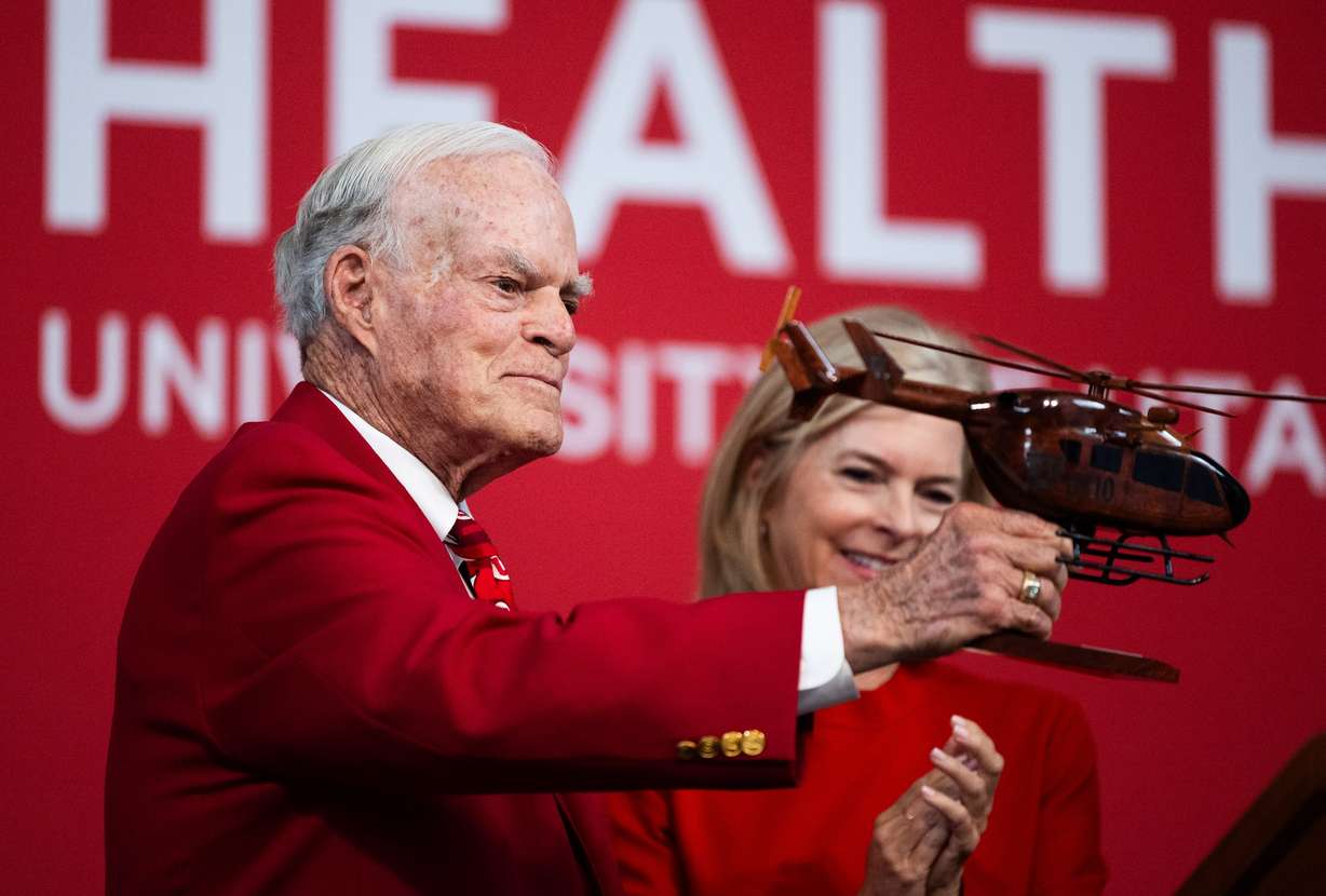 Spencer F. Eccles, CEO and chairman of the George S. and Dolores Doré Eccles Foundation, playfully moves an awarded helicopter memento around in the air during a press conference announcing University of Utah Hospitals and Health will receive $75 from the Foundation to establish a University of Utah West Valley Health Campus.