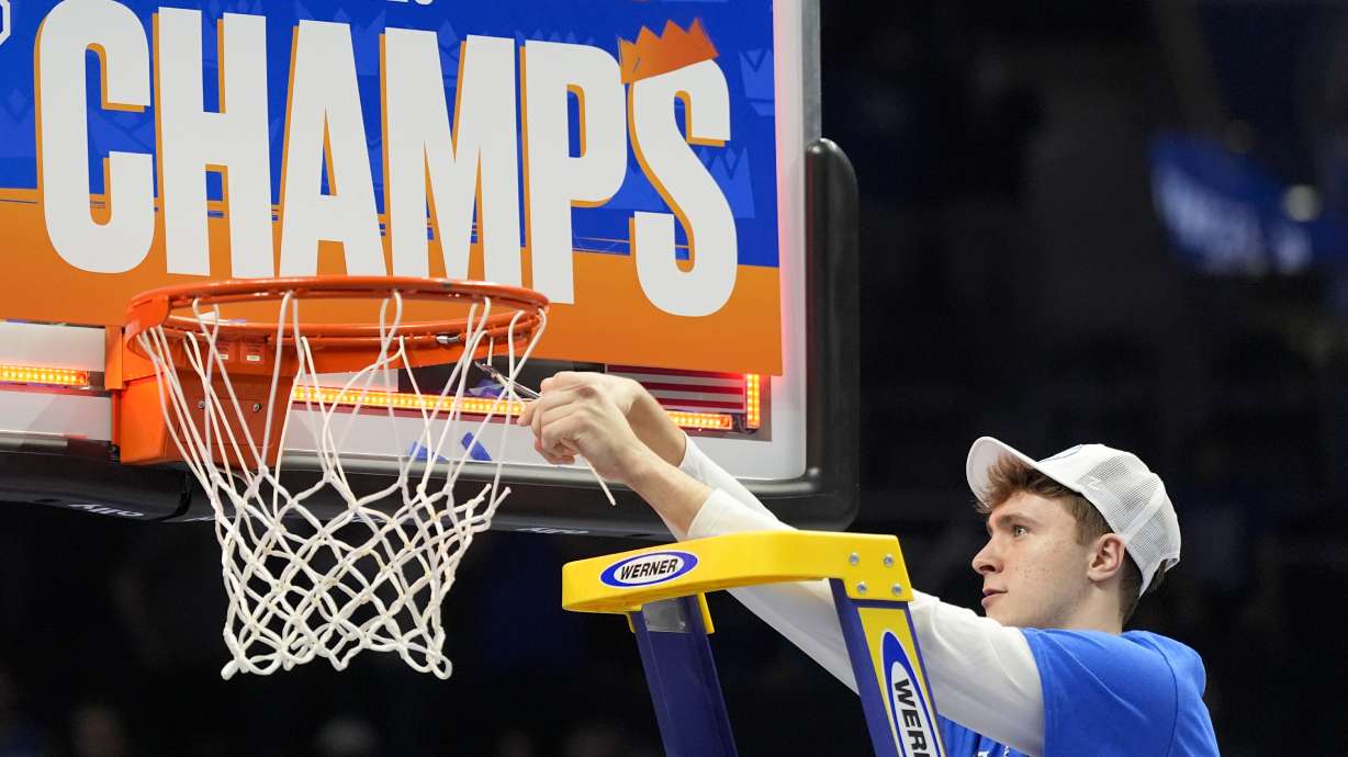 Duke forward Cooper Flagg cuts the net after their win against Louisville after an NCAA college basketball game in the championship of the Atlantic Coast Conference tournament, Saturday, March 15, 2025, in Charlotte, N.C.