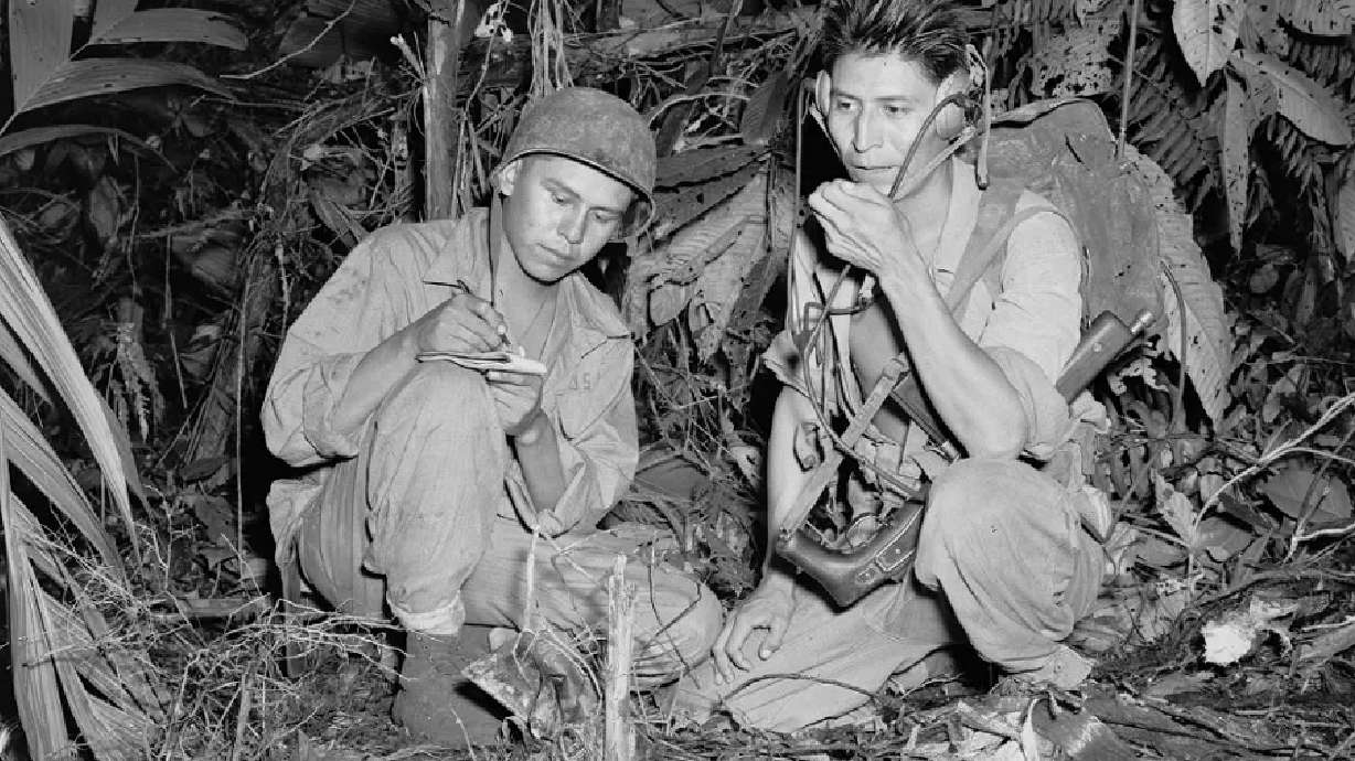 Navajo Code Talkers Henry Bake and George Kirk in December 1943. The U.S. Department of Defense will restore online references to Navajo Code Talkers, it said Tuesday.