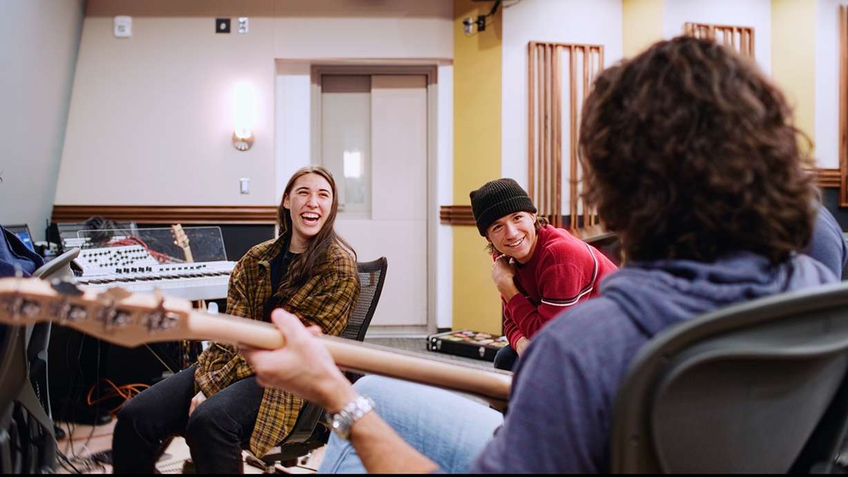 Students Hanna Eyre and Kieran Hellum collaborate with five-time Grammy winner Mark Lettieri at BYU in Provo.
