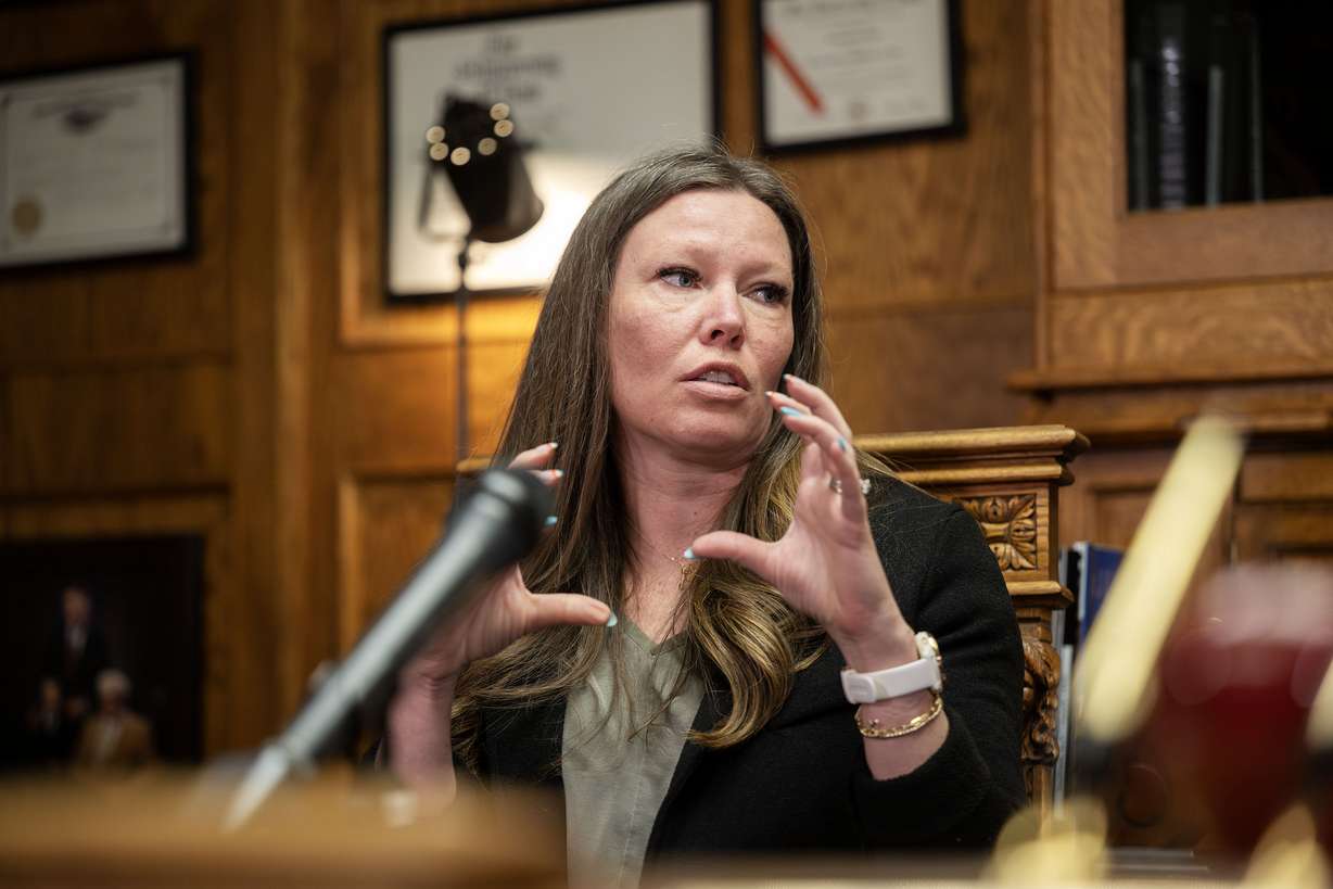 Lauren Tanner, homeowner, gives some of her thoughts as she and her husband, Russell Tanner, and their neighbors, Terry and Christy Smith, join attorney Robert B. Sykes at his firm's office in Salt Lake City announcing a complaint against Matt Lowe, a developer; Fruit Heights; and the state of Utah due to alleged negligence, gross negligence and other serious misconduct regarding a mudslide in their backyards, on Tuesday.