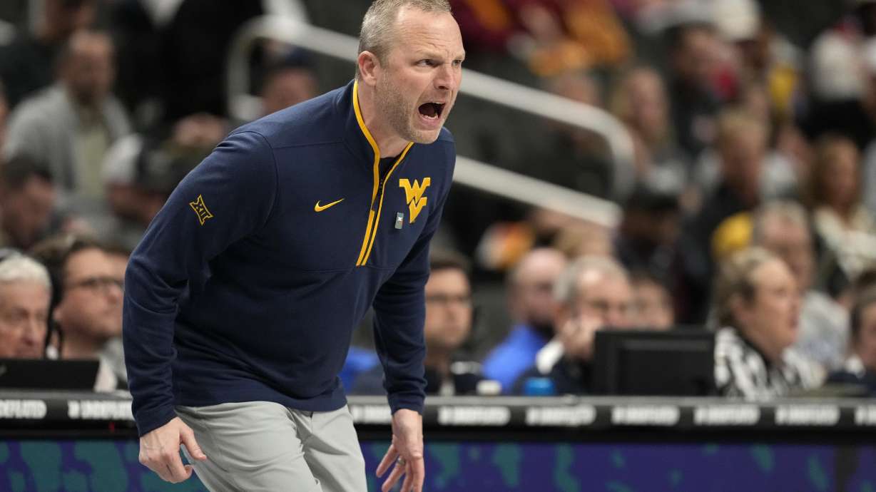West Virginia head coach Darian Devries yells from the sidelines during the first half of an NCAA college basketball game against the Colorado in the second round of the Big 12 Conference tournament, Wednesday, March 12, 2025, in Kansas City, Mo.