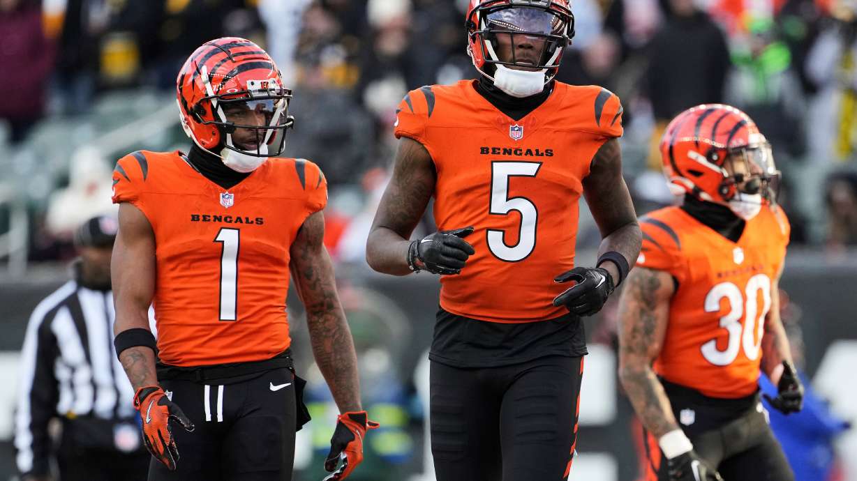 FILE - Cincinnati Bengals wide receiver Ja'Marr Chase, left, and wide receiver Tee Higgins, center, line up for a play during the second half of an NFL football game against the Pittsburgh Steelers, Sunday, Dec. 1, 2024, in Cincinnati.