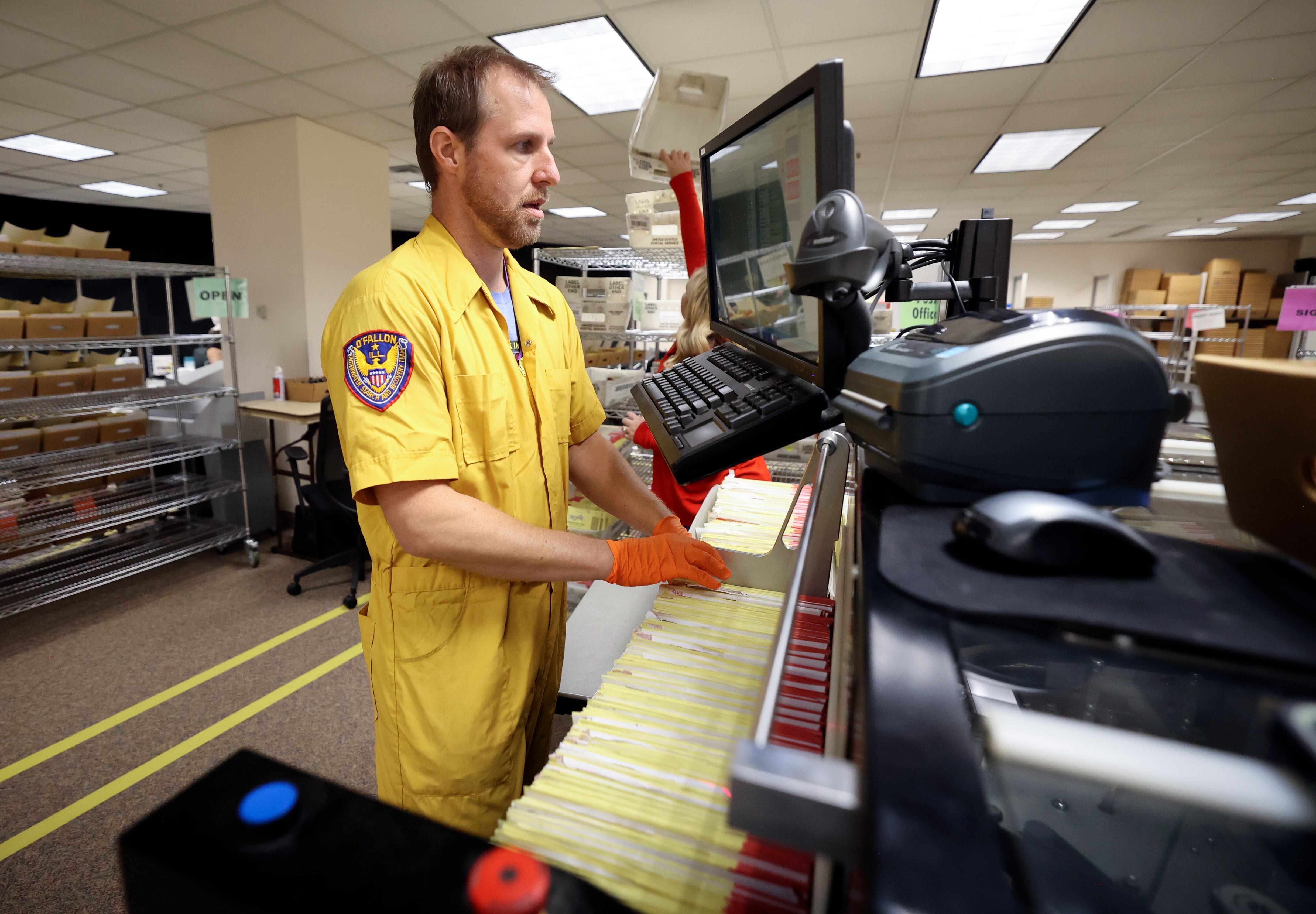 Tim Schorzman runs a ballot sorting machine at the Salt Lake County Government Center in Salt Lake City on Oct. 31, 2024. Utah House Speaker Mike Schultz says the state's new vote-by-mail process is "a huge step" toward better election security.