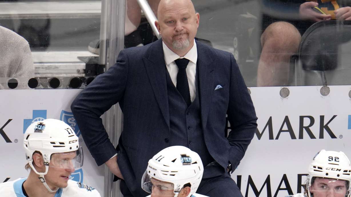 Utah Hockey Club head coach Andre Tourigny stands behind his bench during the third period of an NHL hockey game against the Pittsburgh Penguins, Saturday, Nov. 23, 2024, in Pittsburgh. Utah won 6-1.