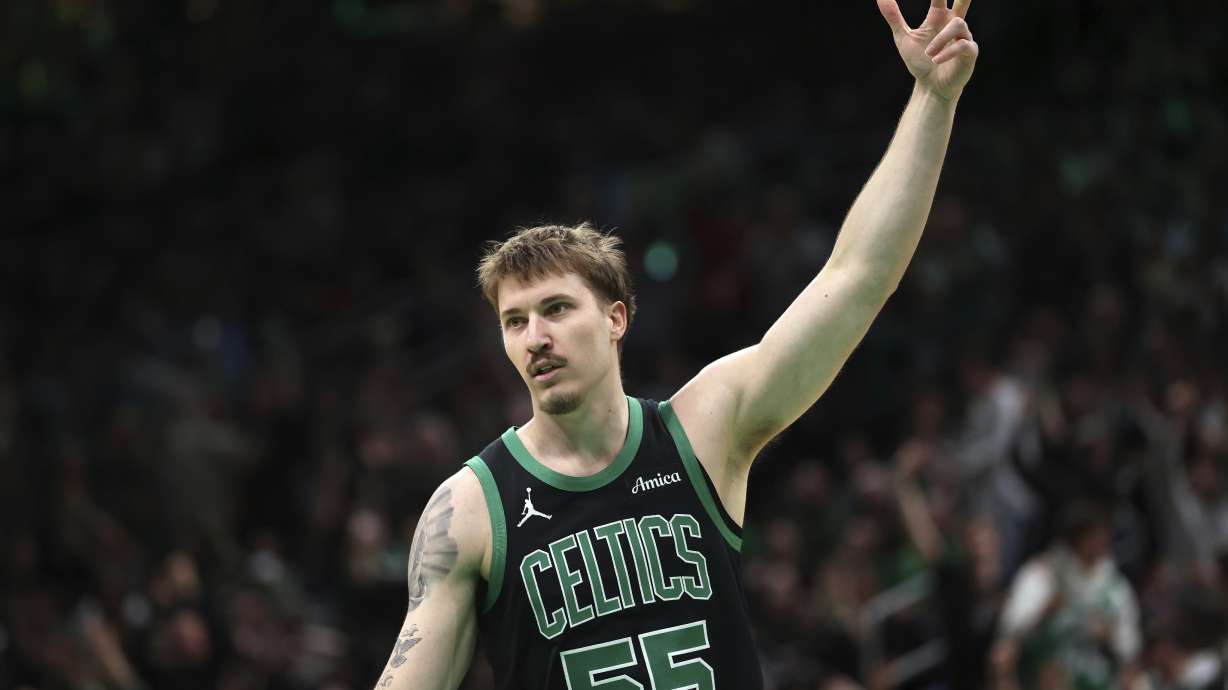 Boston Celtics' Baylor Scheierman celebrates his 3-pointer during second half of an NBA basketball game against the Brooklyn Nets Tuesday, March 18, 2025, in Boston.