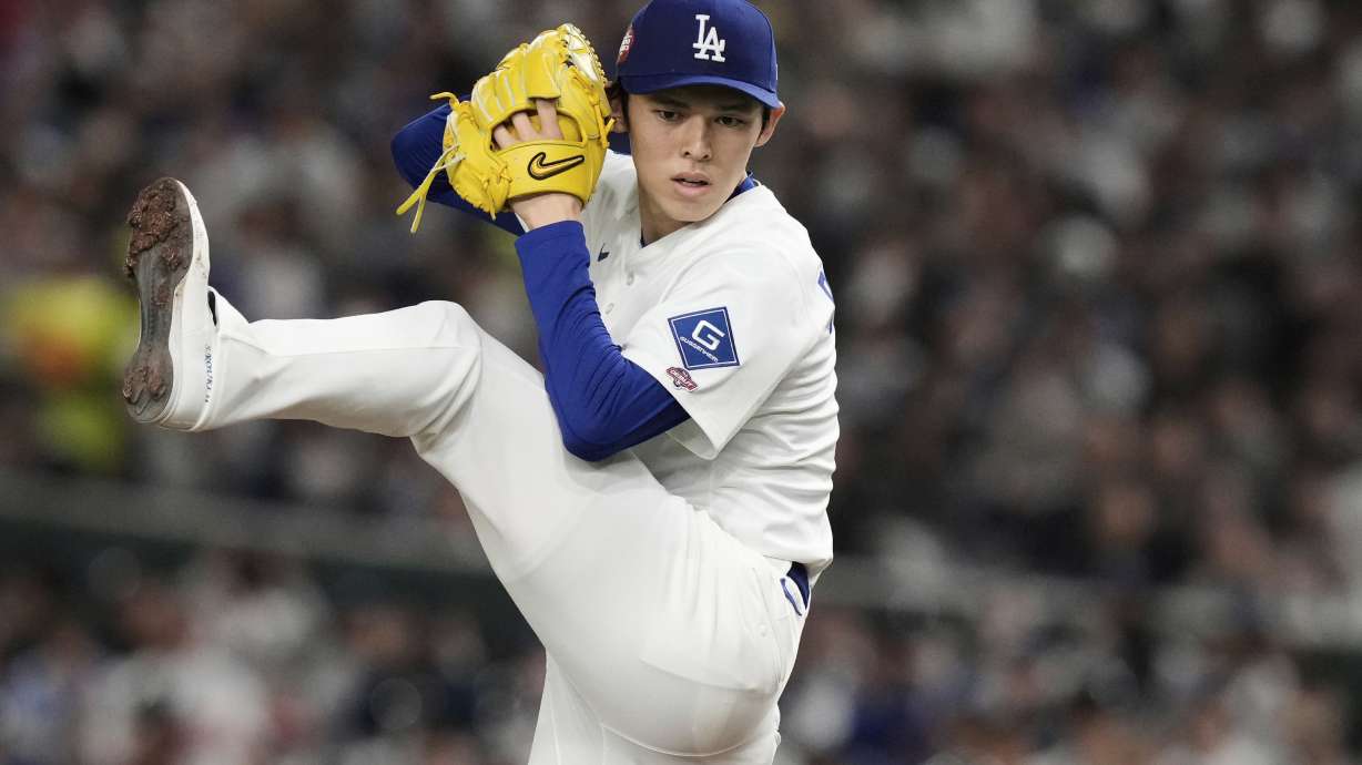 Los Angeles Dodgers starting pitcher Roki Sasaki winds up to deliver to the Chicago Cubs in the first inning of an MLB Tokyo Series baseball game in Tokyo, Japan, Wednesday, March 19, 2025.