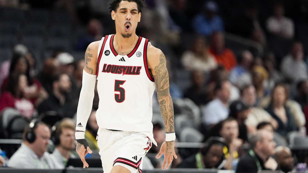 Louisville guard Terrence Edwards Jr. celebrates after scoring against Stanford during the first half of an NCAA college basketball game in the quarterfinals of the Atlantic Coast Conference tournament, Thursday, March 13, 2025, in Charlotte, N.C.