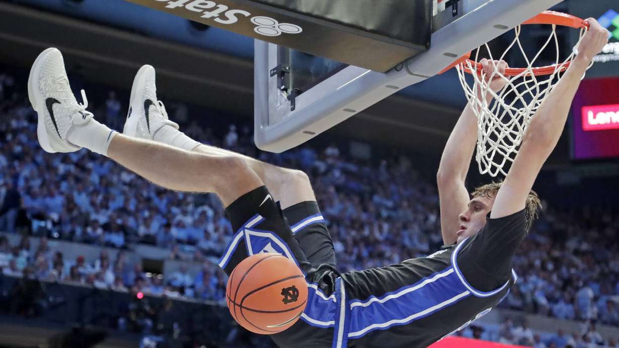 Duke forward Cooper Flagg (2) dunks during the second half of an NCAA college basketball game against North Carolina, Saturday, March 8, 2025, in Chapel Hill, N.C.