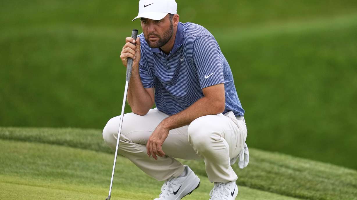 Scottie Scheffler lines up his shot on the second green during the final round of The Players Championship golf tournament Sunday, March 16, 2025, in Ponte Vedra Beach, Fla.