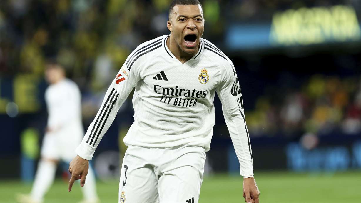 Real Madrid's Kylian Mbappe celebrates after scoring his side's second goal during a Spanish La Liga soccer match between Villarreal and Real Madrid in Villarreal, Spain, Saturday, March 15, 2025.