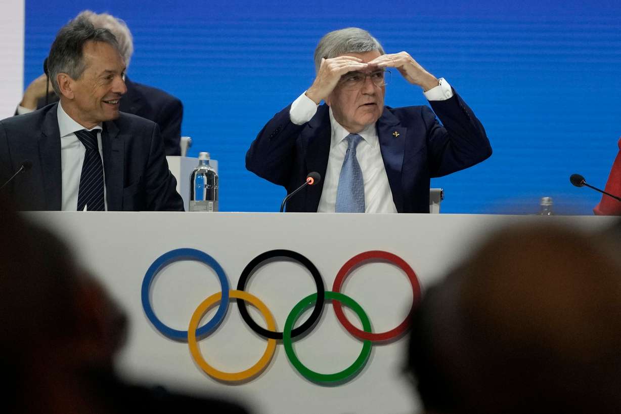 International Olympic Committee president Thomas Bach, right, leads over the 144th session which will elect the new committee president, in Costa Navarino, western Greece, Wednesday.