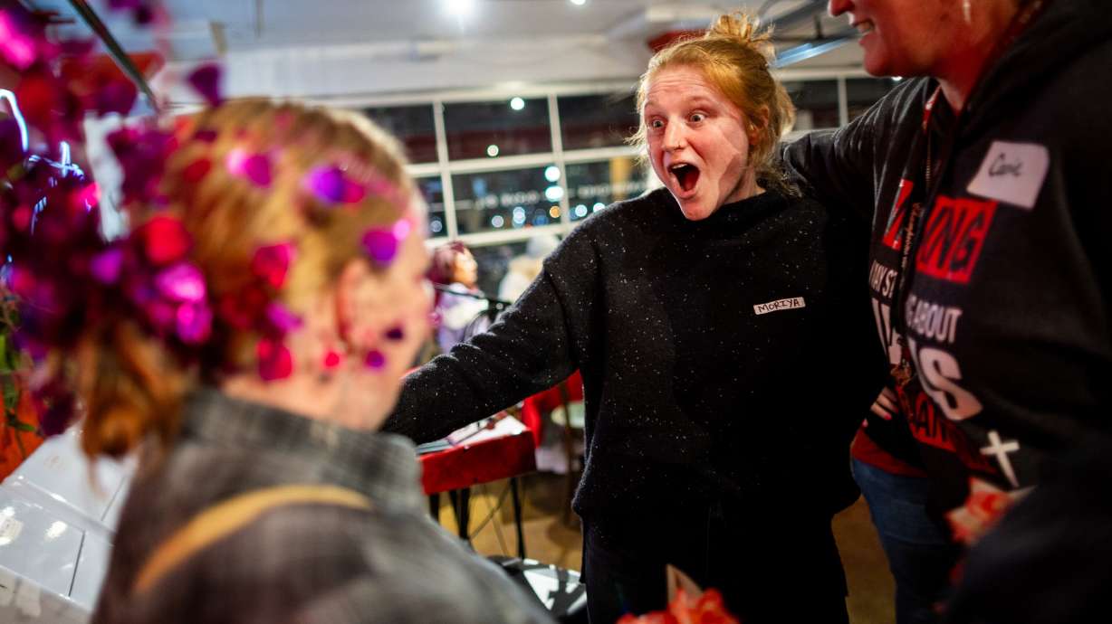 Volunteer vocalist Moriya Krinke, center, and Misty Drake, left, at the 15th Annual Valentine’s Banquet for the Homeless Women of Salt Lake City in Salt Lake City on Feb. 16. An event Wednesday highlighted volunteerism in Utah.