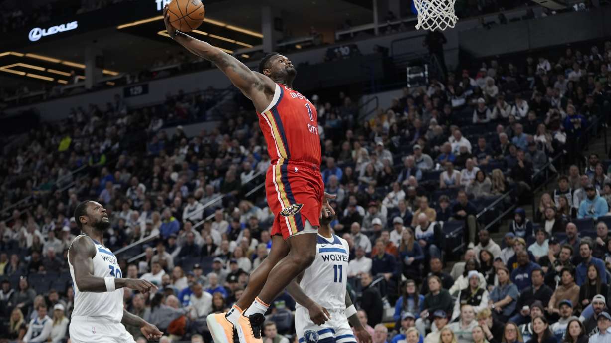 New Orleans Pelicans forward Zion Williamson (1) dunks during the first half of an NBA basketball game against the Minnesota Timberwolves, Wednesday, March 19, 2025, in Minneapolis.