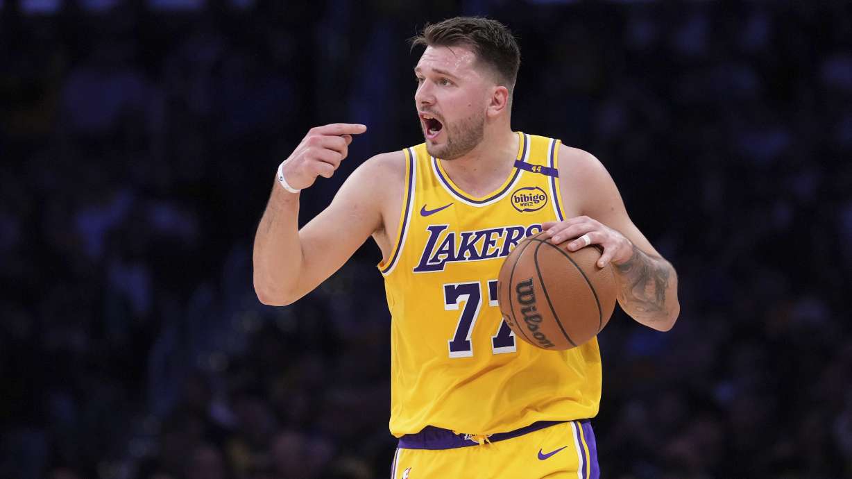 Los Angeles Lakers guard Luka Doncic gestures during the first half of an NBA basketball game against the Denver Nuggets, Wednesday, March 19, 2025, in Los Angeles.