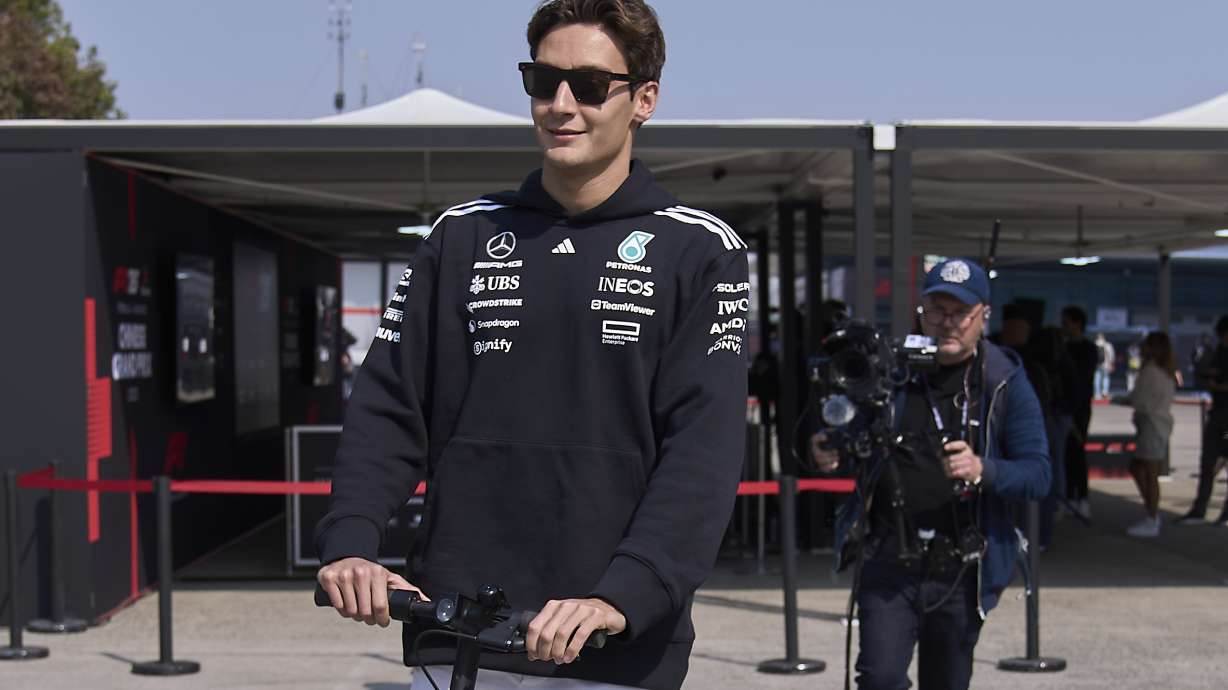 Mercedes driver George Russell of Britain arrives at the Shanghai International Circuit ahead of the Chinese Formula One Grand Prix, in Shanghai, China, Thursday, March 20, 2025.