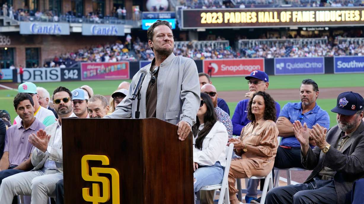 Former San Diego Padres pitcher Jake Peavy speaks during his induction into the Padres Hall of Fame during a ceremony before a baseball game against the Texas Rangers Friday, July 28, 2023, in San Diego.