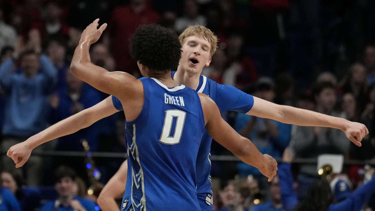Creighton players celebrate a win against Louisville after the first round of the NCAA college basketball tournament, Thursday, March 20, 2025, in Lexington, Ky.