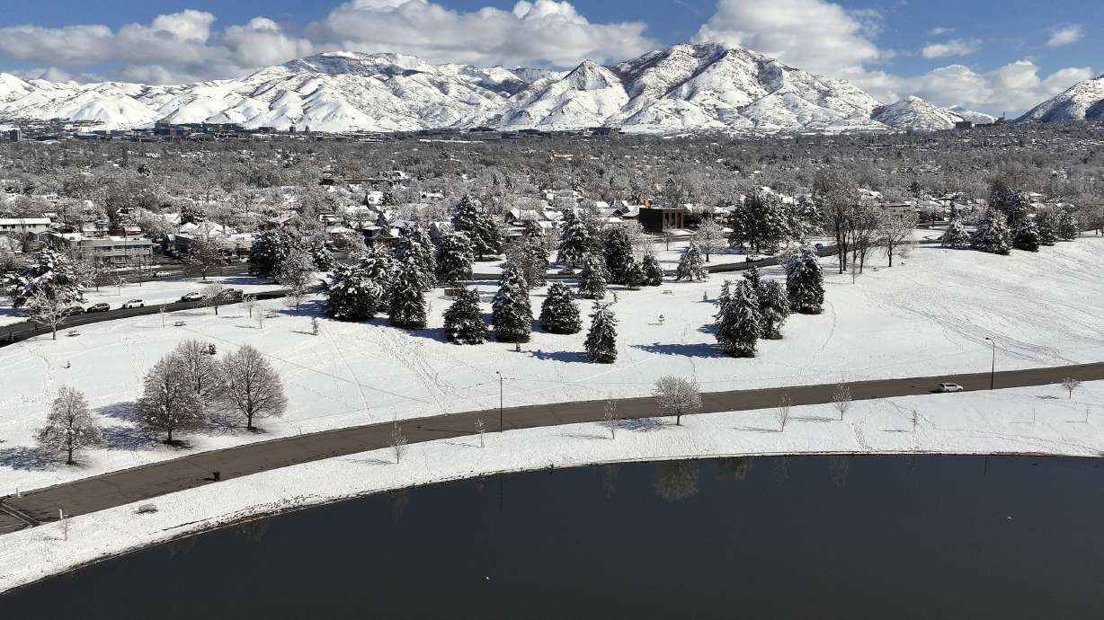Snow blankets Sugar House Park and Salt Lake City on Wednesday. Utah's snowpack has benefited from recent storms, but Gov. Spencer Cox said Thursday some regions are going to have to make some water sacrifices this year.