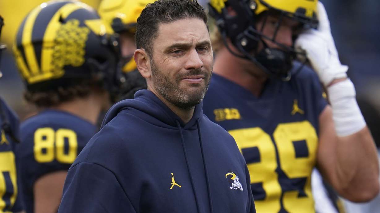 FILE - Michigan co-offensive coordinator and quarterbacks coach Matt Weiss watches before an NCAA college football game against Maryland in Ann Arbor, Mich., Sept. 24, 2022.