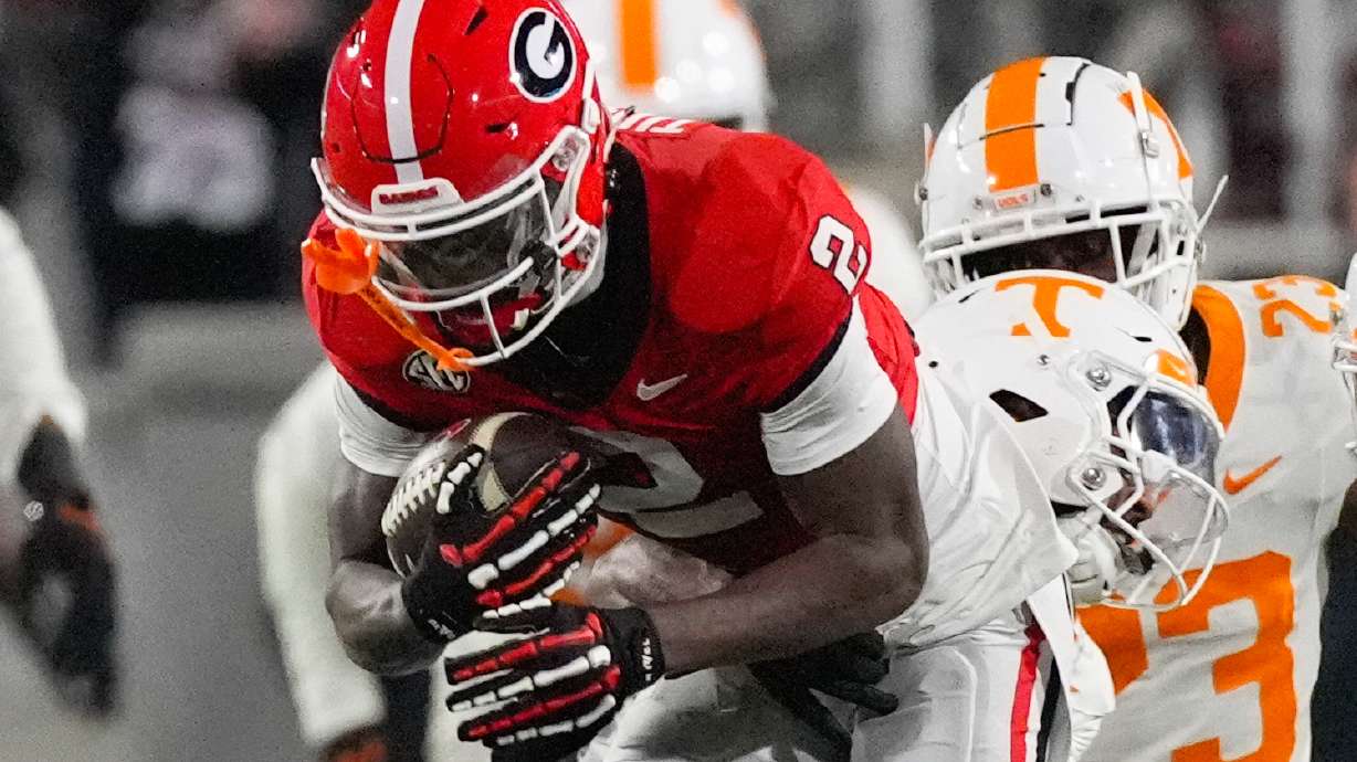 FILE - Georgia wide receiver Nitro Tuggle (2) is stopped by Tennessee defensive back Andre Turrentine (2) during the second half of an NCAA college football game, Saturday, Nov. 16, 2024, in Athens, Ga.