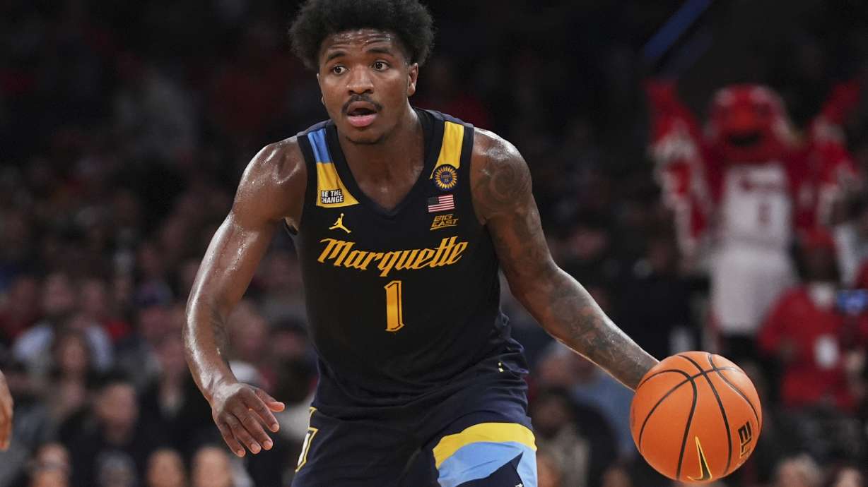 Marquette's Kam Jones (1) looks to pass during the second half of an NCAA college basketball game against the St. John's in the semifinals of the Big East tournament Friday, March 14, 2025, in New York.