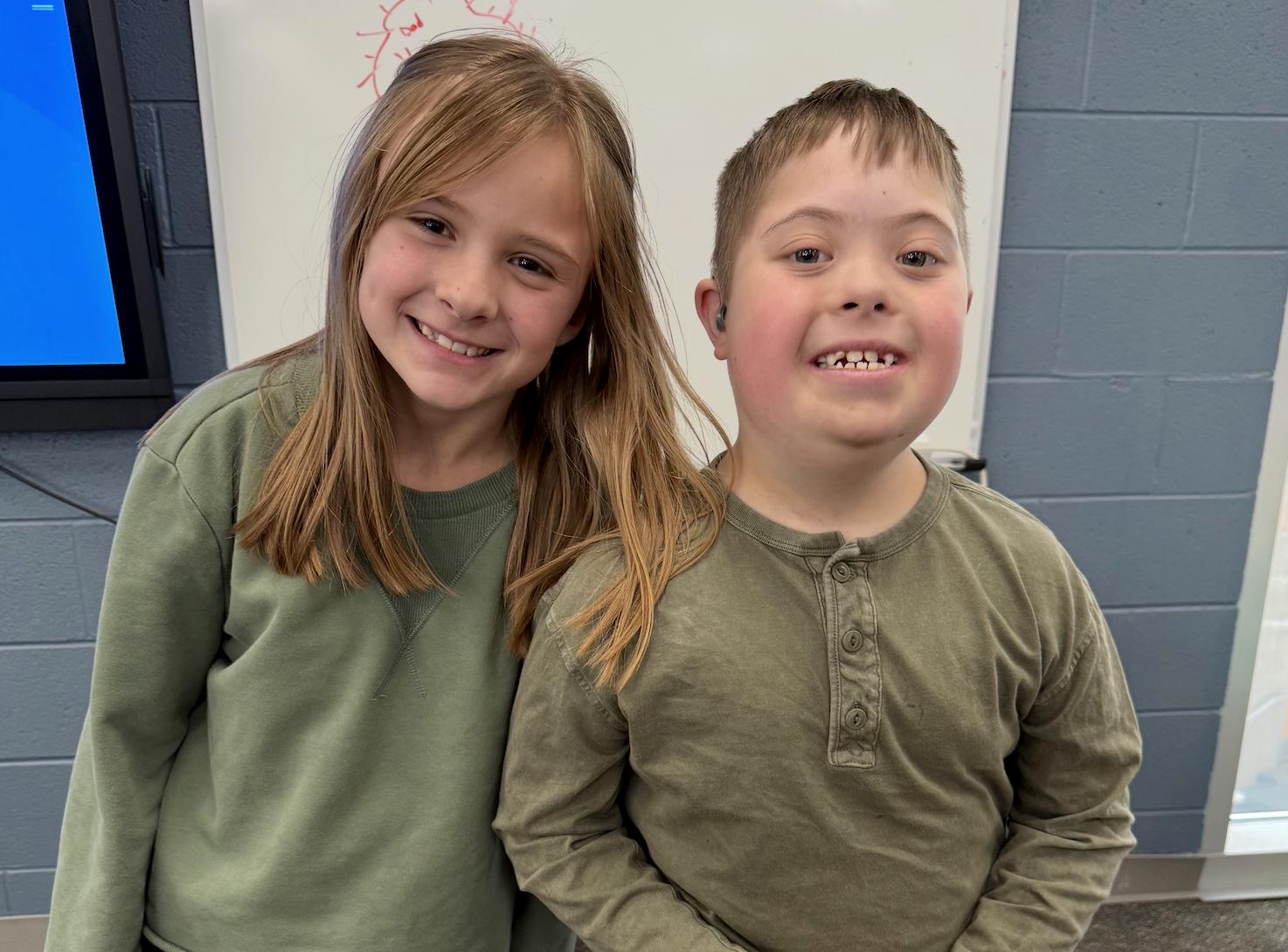 Jude Garrett, 9, and his friend Daphne Strand attend third grade in different schools in Weber County.
