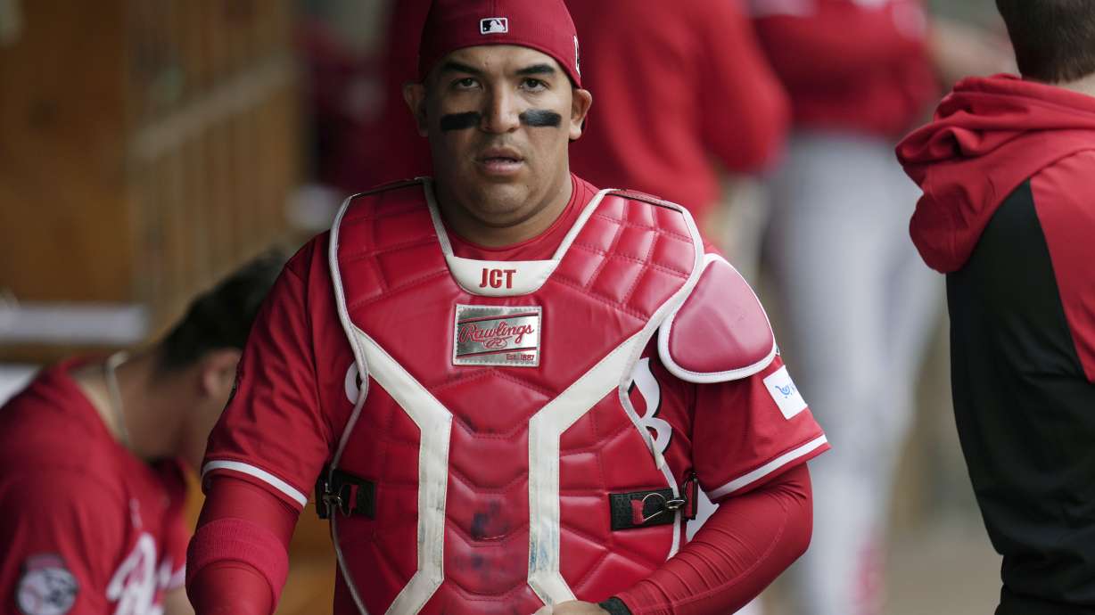 Cincinnati Reds catcher Jose Trevino walks through the dugout during the first inning of a spring training baseball game against the Arizona Diamondbacks, Friday, March 14, 2025, in Scottsdale, Ariz.