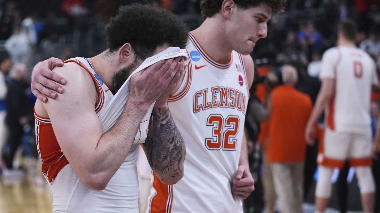 Clemson guard Jaeden Zackery, left, react after a loss to McNeese State in the first round of the NCAA college basketball tournament, Thursday, March 20, 2025, in Providence, R.I.
