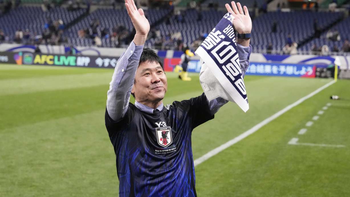 Japan's head coach Hajime Moriyasu acknowledges the applause from the crowd after their win against Bahrain in the World Cup qualifying soccer match at Saitama Stadium in Saitama, Japan, Thursday, March 20, 2025.