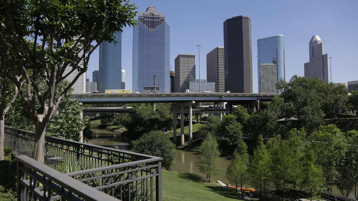 FILE - The Houston skyline overlooks the Buffalo Bayou as it snakes its' way into downtown Friday, April 18, 2014.