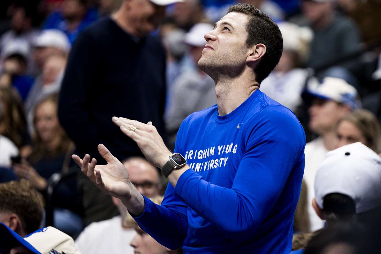 Former BYU basketball star Jimmer Fredette claps during a first-round college basketball game in the NCAA Tournament between the BYU Cougars and the Virginia Commonwealth Rams held at Ball Arena in Denver, Colo., on Thursday, March 20, 2025.