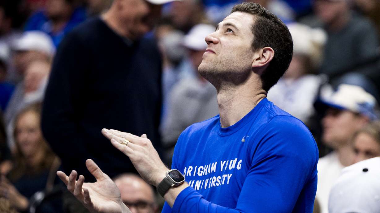 Former BYU basketball star Jimmer Fredette claps during a first-round college basketball game in the NCAA Tournament between the BYU Cougars and the Virginia Commonwealth Rams held at Ball Arena in Denver, Colo., on Thursday, March 20, 2025.