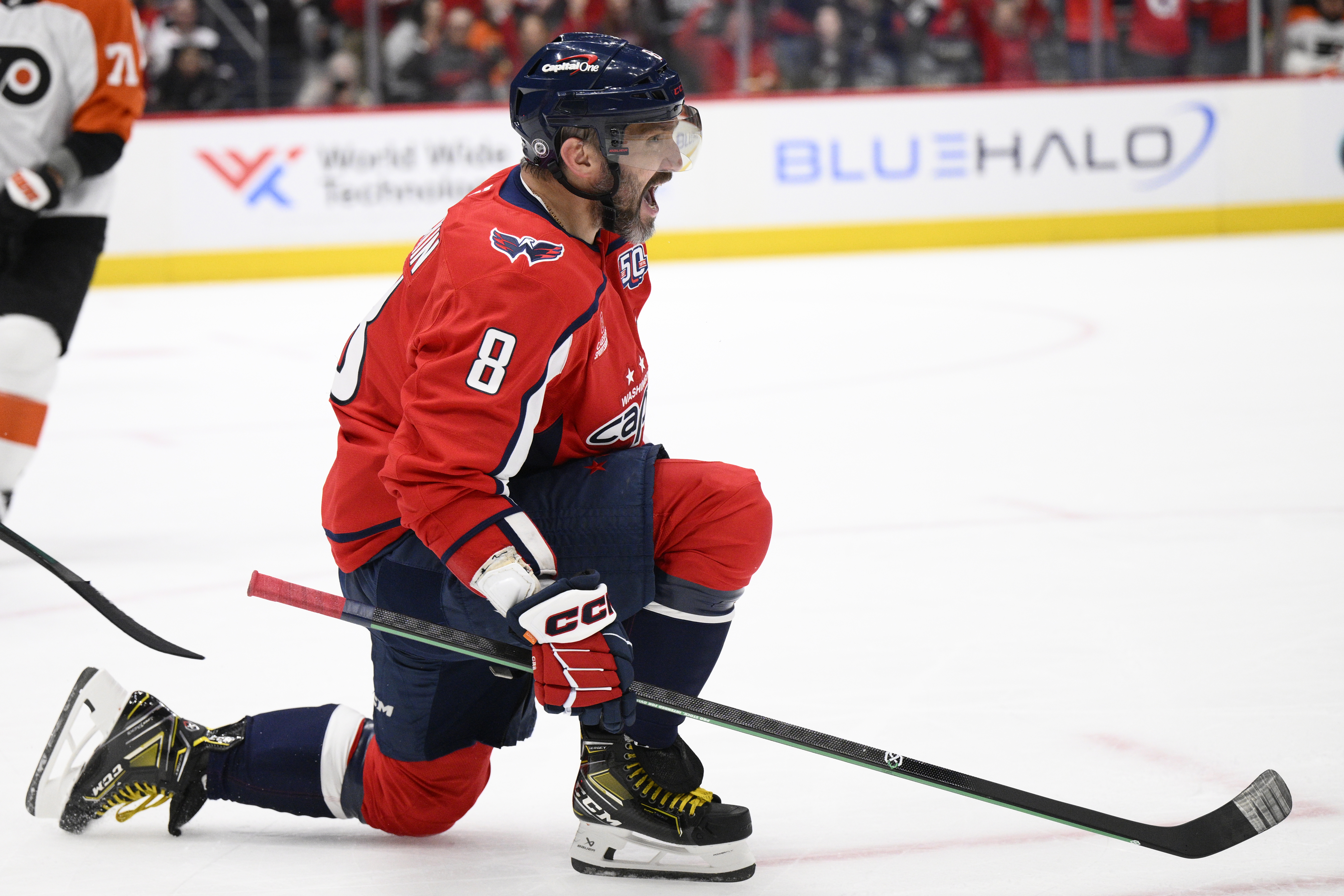 Washington Capitals left wing Alex Ovechkin (8) celebrates after his goal during the first period of an NHL hockey game against the Philadelphia Flyers, Thursday, March 20, 2025, in Washington.