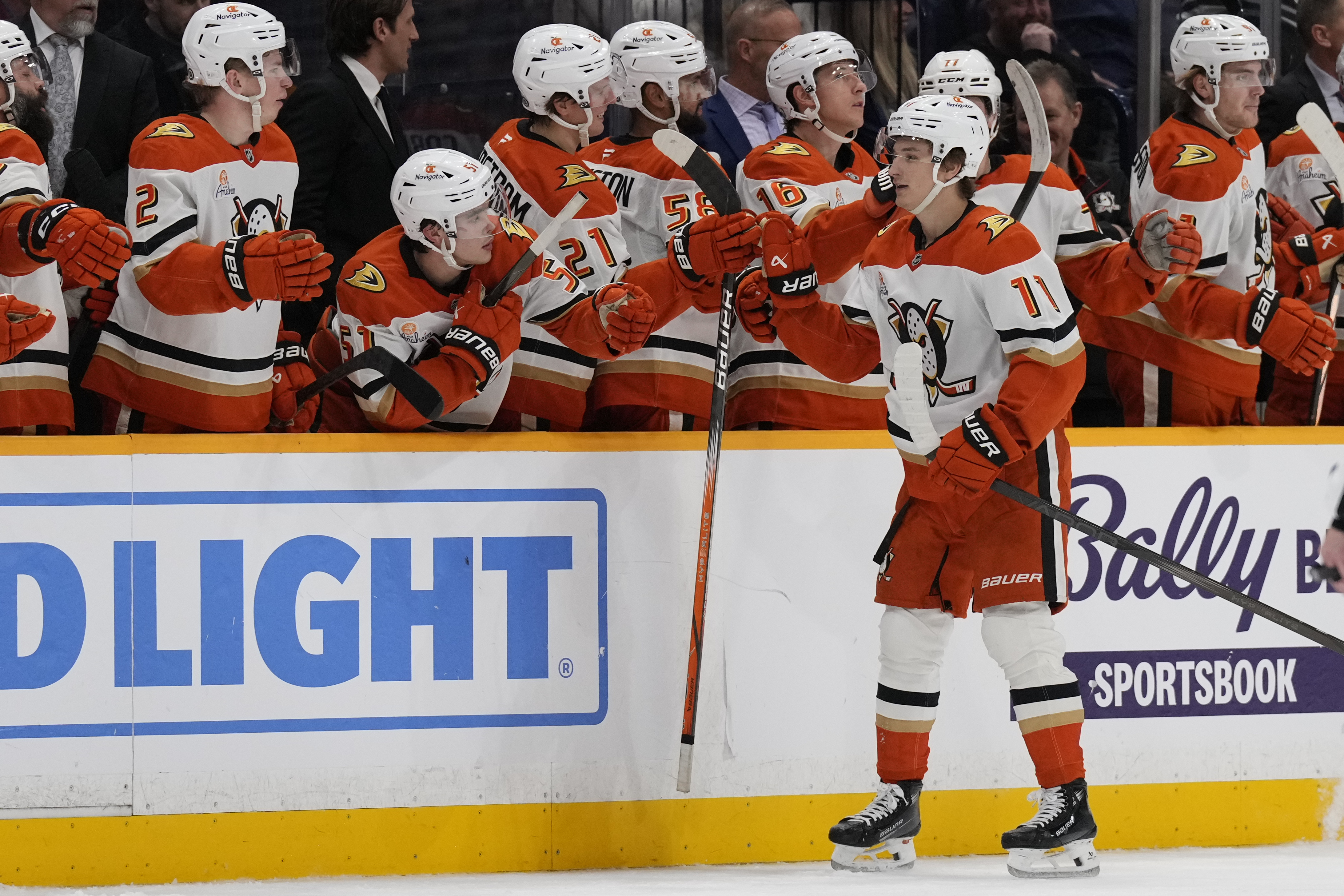 Anaheim Ducks center Trevor Zegras (11) celebrates his goal with teammates during the second period of an NHL hockey game against the Nashville Predators, Thursday, March 20, 2025, in Nashville, Tenn.