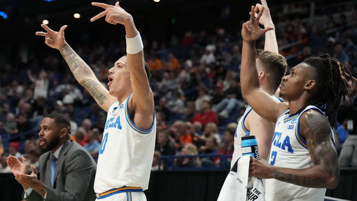 The UCLA bench cheers play against Utah State during the second half in the first round of the NCAA college basketball tournament, Thursday, March 20, 2025, in Lexington, Ky.