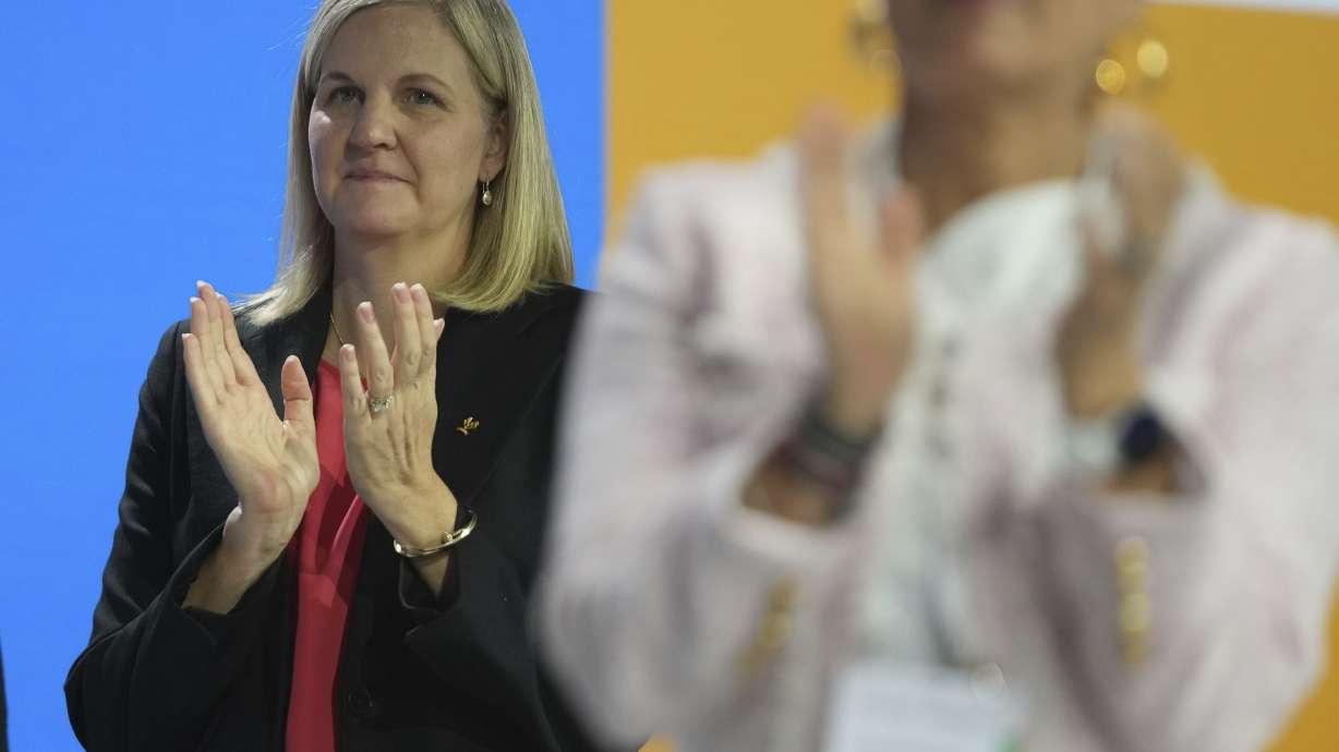 IOC President-elect Kirsty Coventry applauds during the International Olympic Committee 144th session in Costa Navarino, western Greece, Friday, March 21, 2025.