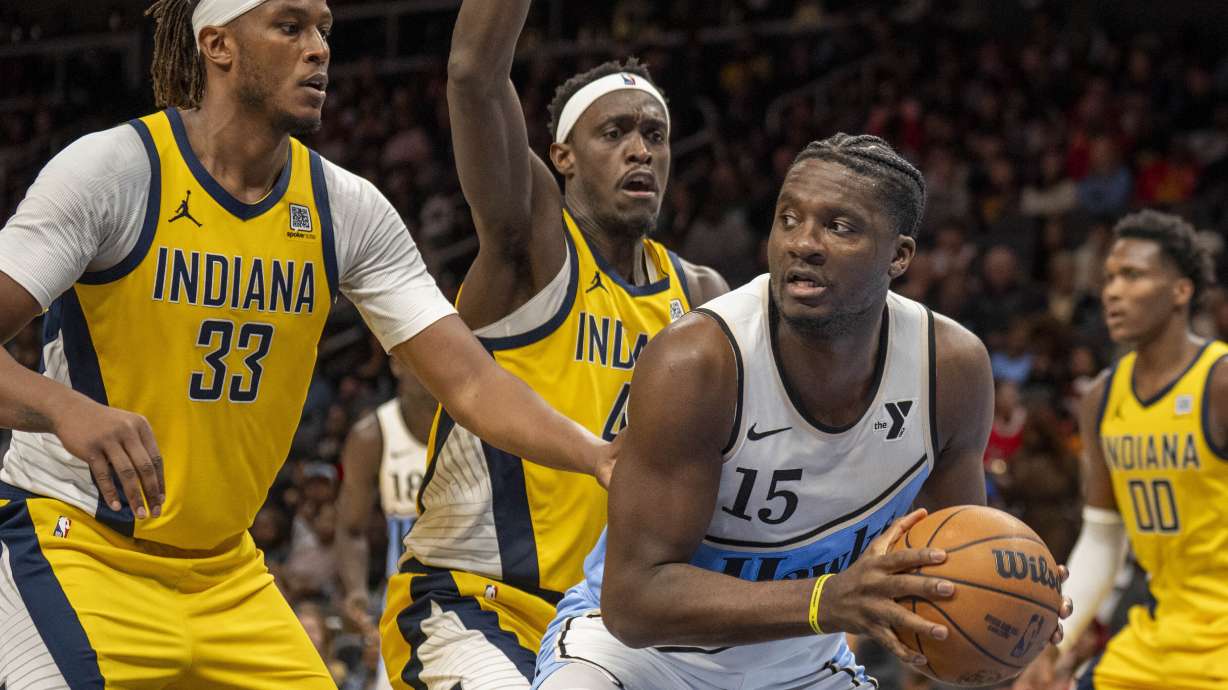 Atlanta Hawks center Clint Capela (15), right, fights for position against Indiana Pacers center Myles Turner (33), left, during the second half of an NBA basketball game, Saturday, March 8, 2025, in Atlanta.