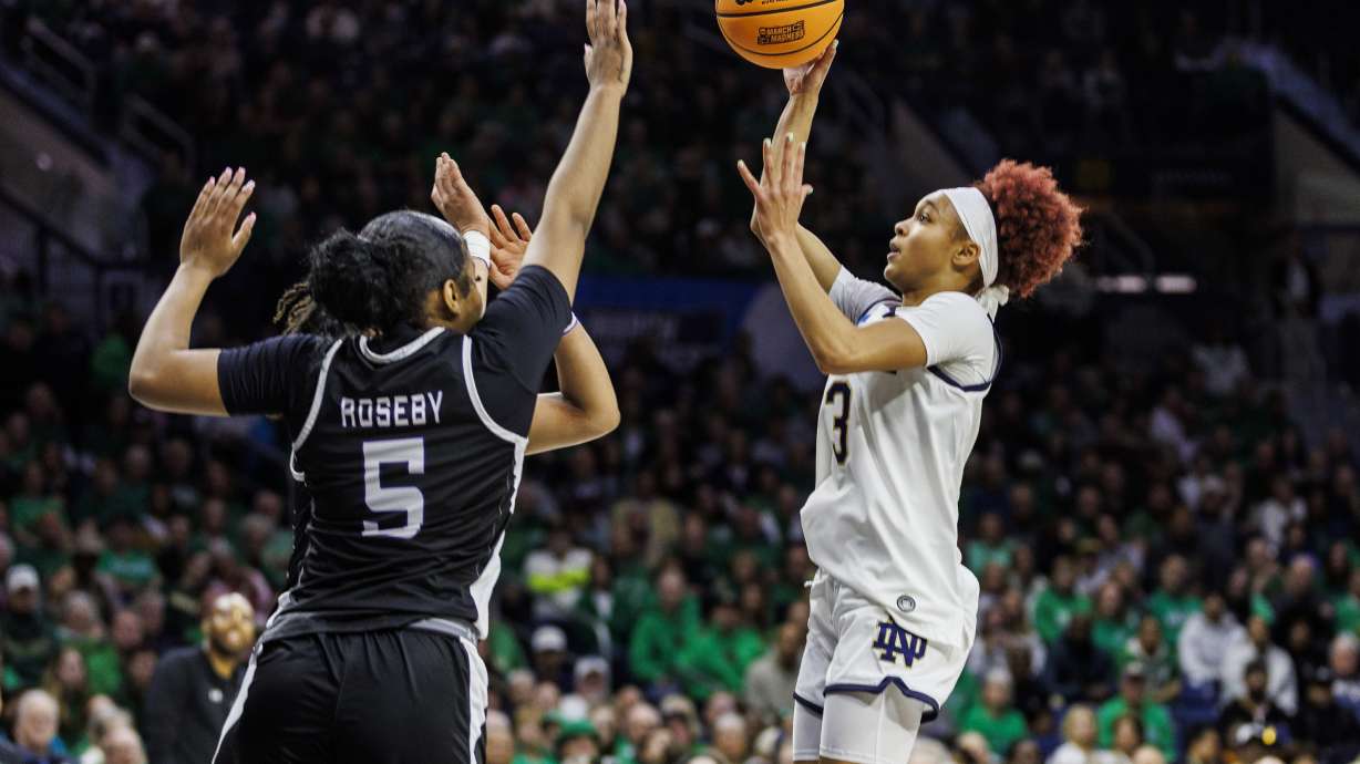Notre Dame guard Hannah Hidalgo (3) shoots over Stephen F. Austin guard Key Roseby (5) during the first half in the first round of the NCAA college basketball tournament, Friday, March 21, 2025, in South Bend, Ind.