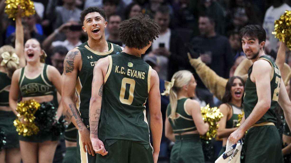 Colorado State guard Nique Clifford, facing, celebrates a 78-70 win with guard Kyan Evans (0) against Memphis in the first round of the NCAA college basketball tournament, Friday, March 21, 2025 in Seattle.