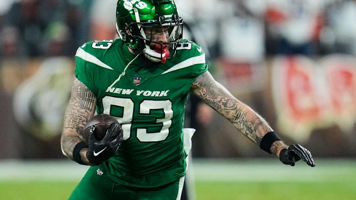 FILE - New York Jets tight end Tyler Conklin (83) carries the ball in the second half of an NFL football game against the Cleveland Browns, Thursday, Dec. 28, 2023, in Cleveland.