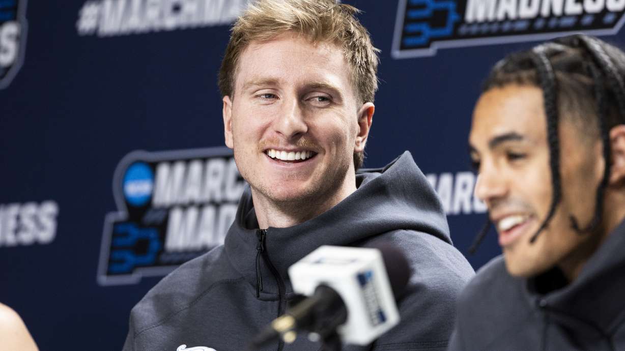 BYU Cougars guard Dawson Baker laughs as guard Trey Stewart answers a question from a reporter during a press conference held at Ball Arena in Denver, Colo., on Friday, March 21, 2025.