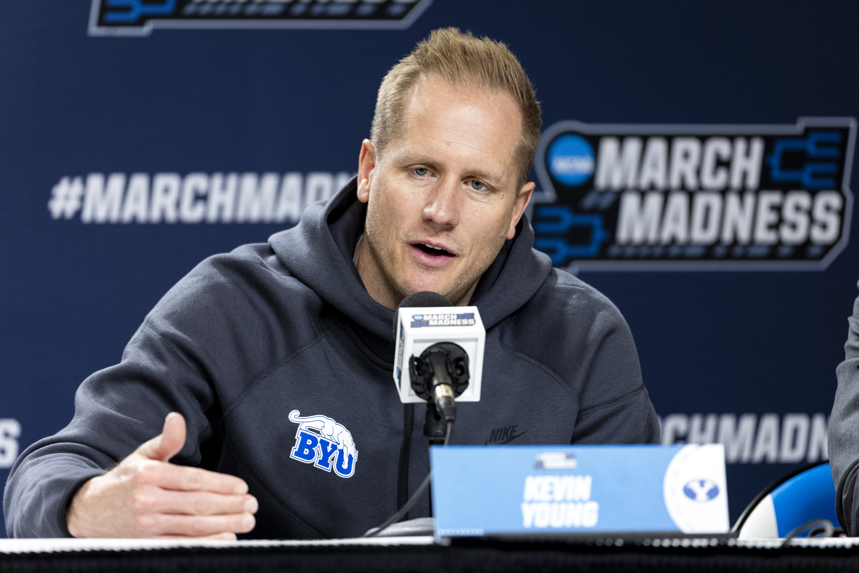 Byu Cougar's head coach Kevin Young will answer a question of a reporter during a press conference in the Ball Arena in Denver, Colorado on Friday, March 21, 2025.