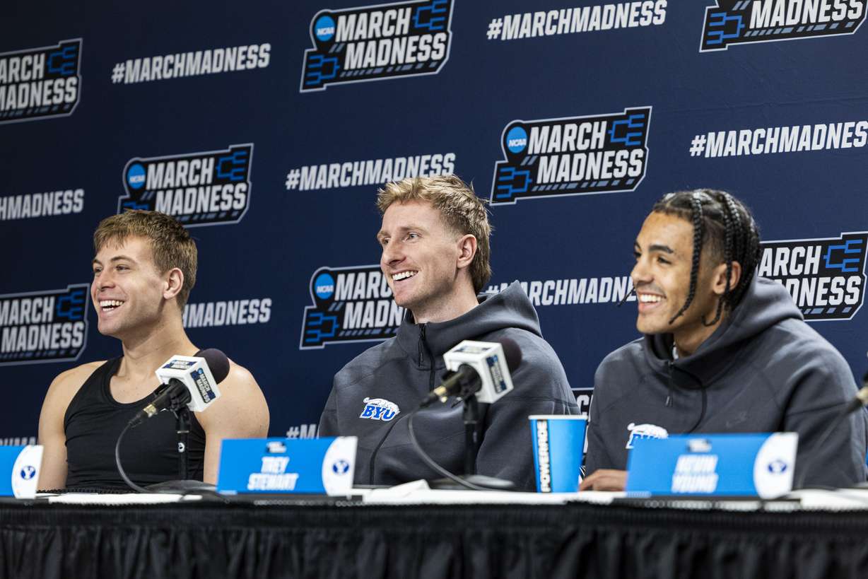 From left, BYU Cougars guards Dallin Hall, Dawson Baker, and Trey Stewart laugh as they field questions from reporters during a press conference held at Ball Arena in Denver, Colo., on Friday, March 21, 2025.