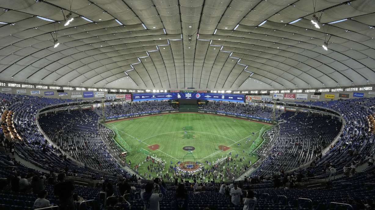 The Los Angeles Dodgers and the Chicago Cubs warm up in the Tokyo Dome before an MLB Tokyo Series baseball game in Tokyo, Japan, Wednesday, March 19, 2025.