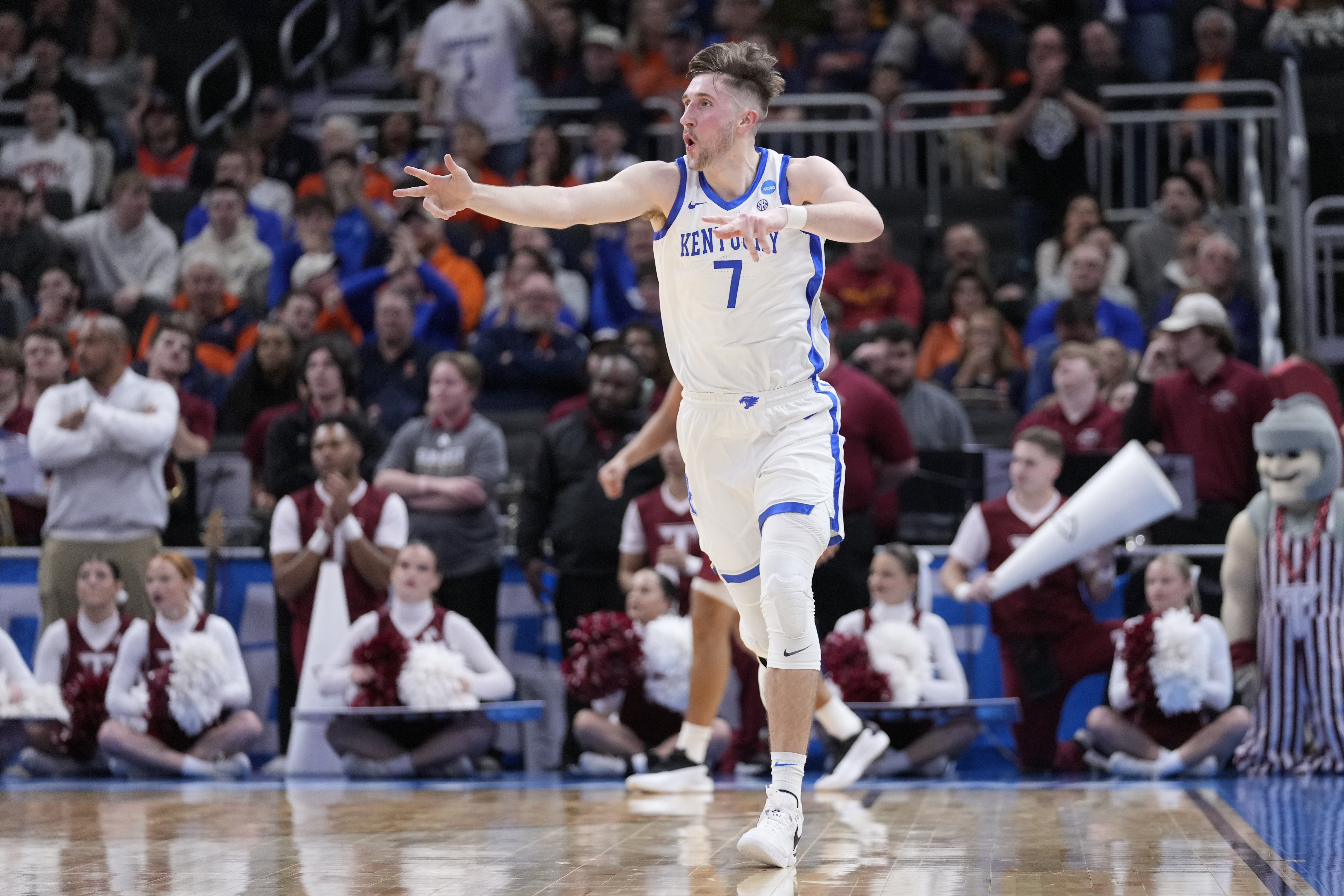 Kentucky forward Andrew Carr (7) reacts to scoring a three point basket against Troy during the first half in the first round of the NCAA college basketball tournament, Friday, March 21, 2025, in Milwaukee.