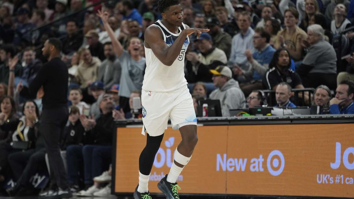 CORRECTS TO FIRST HALF NOT SECOND HALF - Minnesota Timberwolves guard Anthony Edwards (5) gestures after making a 3-point shot during the first half of an NBA basketball game against the New Orleans Pelicans, Friday, March 21, 2025, in Minneapolis.